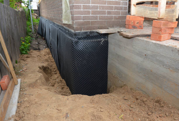 SJ Waterproofing Pros technician performing targeted Basement Waterproofing assessment in Bellwood, VA